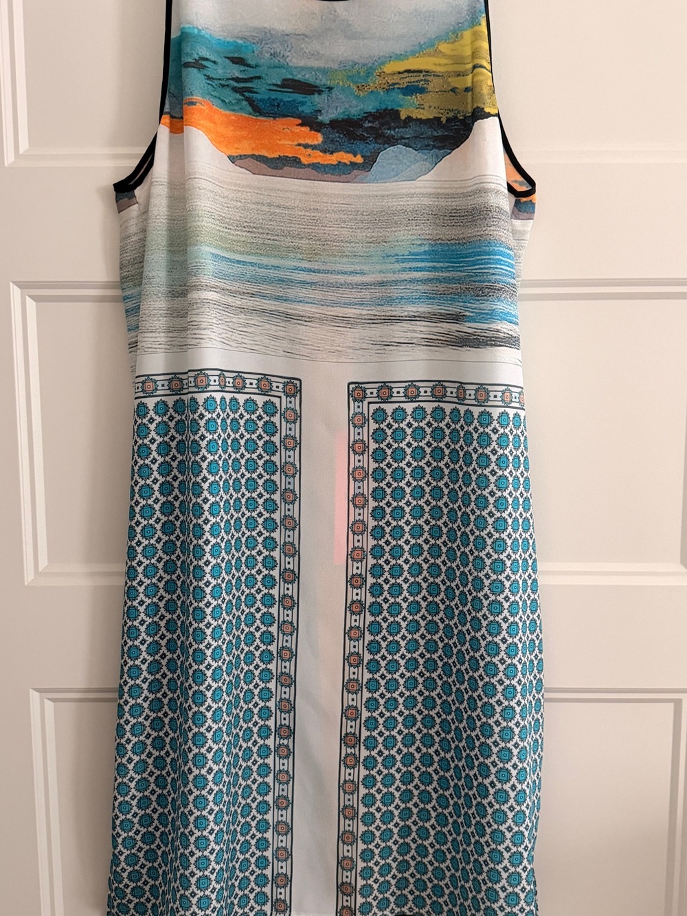 Clover Cannon sleeveless dress with neutral colors. The dress flows nicely!